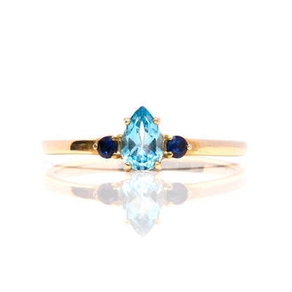 Anillo con Topacio Azul y Zafiros