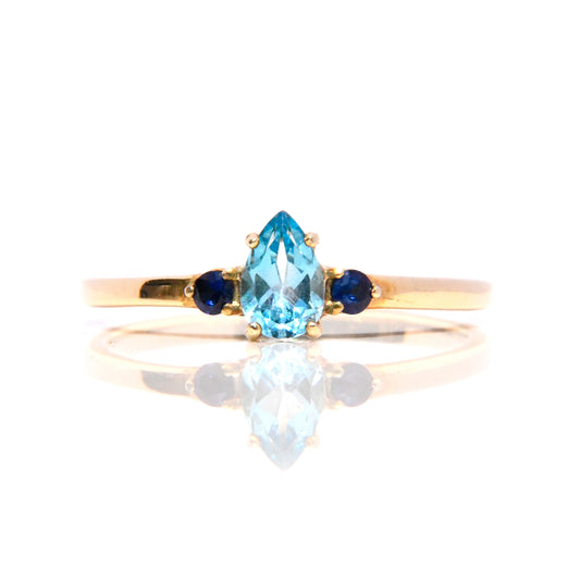 Anillo con Topacio Azul y Zafiros
