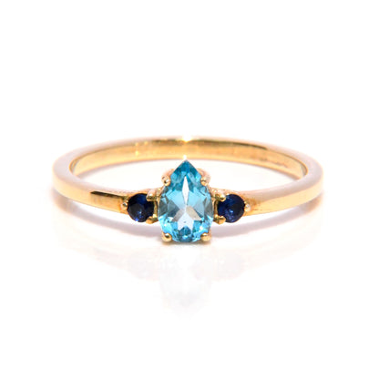 Anillo con Topacio Azul y Zafiros