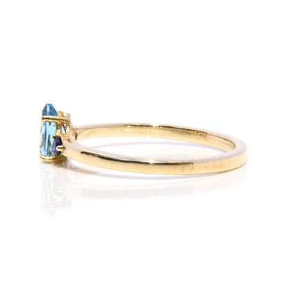 Anillo con Topacio Azul y Zafiros